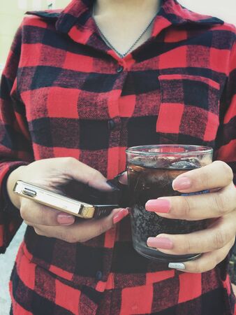 Cola with ice cubesの写真素材