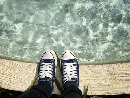 Selfie of sneakers on poolの写真素材