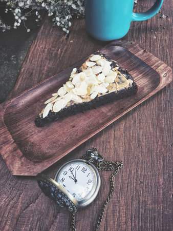 Chocolate brownies cake with vintage watch pocket