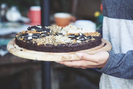 Chocolate brownies cake on hands
