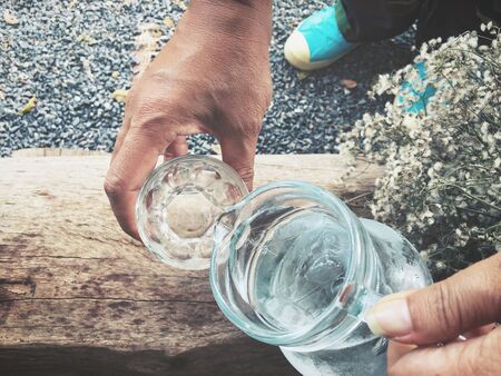 Water drink with handの写真素材
