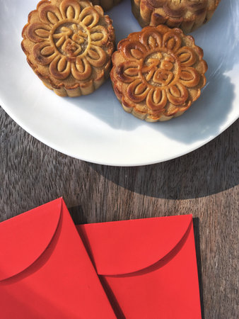 Red envelope with festival moon cake in chinese new year
