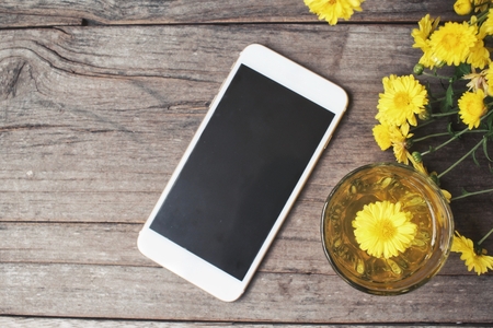 Chamomile tea with smart phoneの写真素材