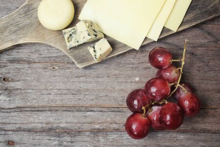 Cheese various and grapesの写真素材