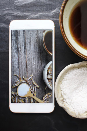 Taking a photo of fish sauce with smart phone