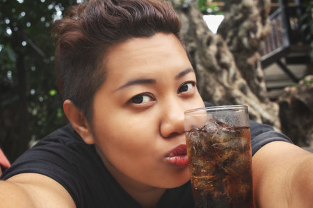 Woman selfie with cola drink