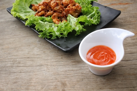 Fried chicken chinese food with sriracha sauceの写真素材