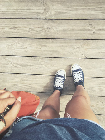 Selfie of sneakers with bag