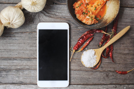 Kimchi korean food with smart phoneの写真素材