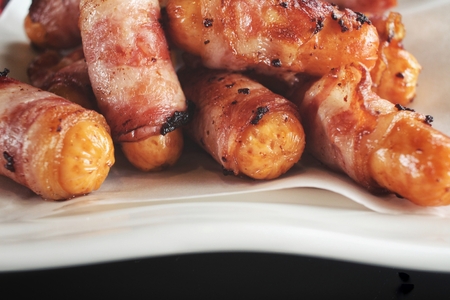 Sausage wrapped in baconの写真素材