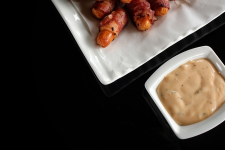 Sausage wrapped in baconの写真素材