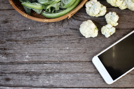Cauliflower with smart phoneの写真素材