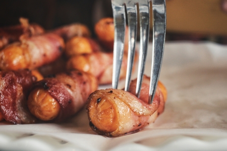 Sausage wrapped in baconの写真素材