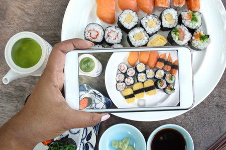 Taking a photo of with sushi set smart phone