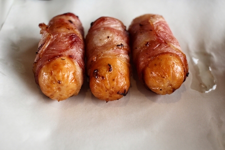 Sausage wrapped in baconの写真素材