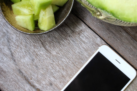 Melon with smart phoneの写真素材