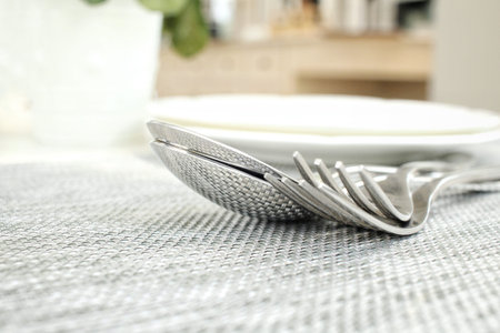 Empty dish with spoon and fork
