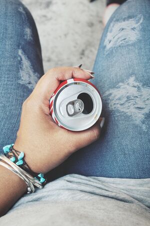 Selfie of hand with cola canの写真素材