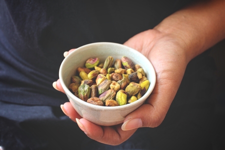 Pistachio on handの写真素材