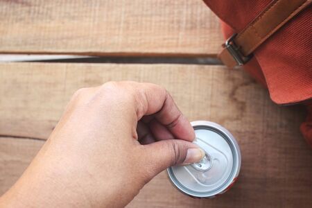 Selfie of cola can with handの写真素材