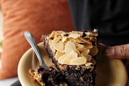 Selfie of woman with chocolate brownies cakeの写真素材