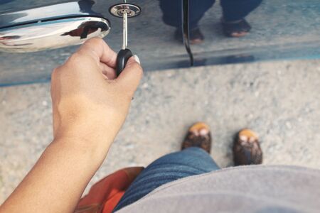 Woman opens the door carの写真素材