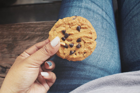 Woman eating cookie chocolate