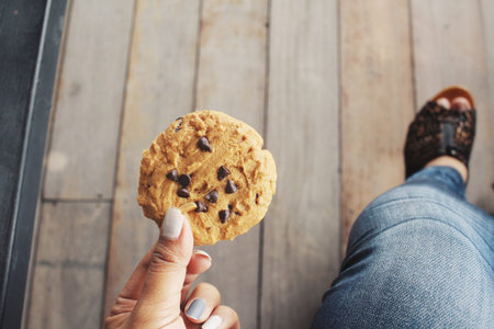 Woman eating cookie chocolate