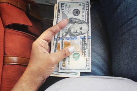 Dollar with hand and bagの写真素材