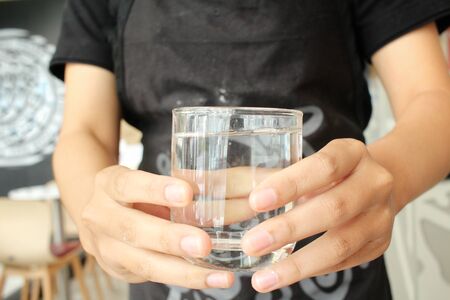 Woman serving water drinkの写真素材