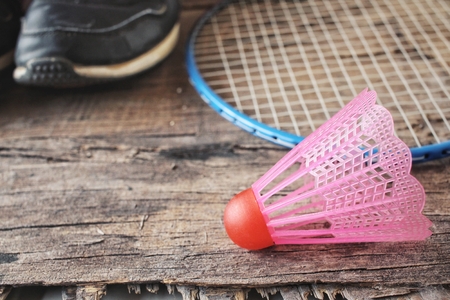 Shuttlecocks with badminton racket and shoes sportの写真素材