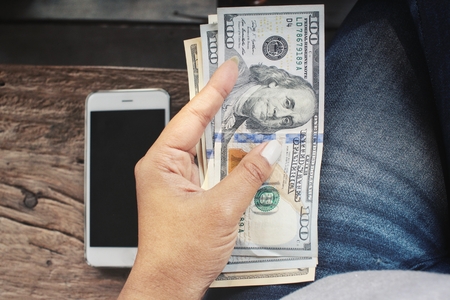 Dollar with handの写真素材