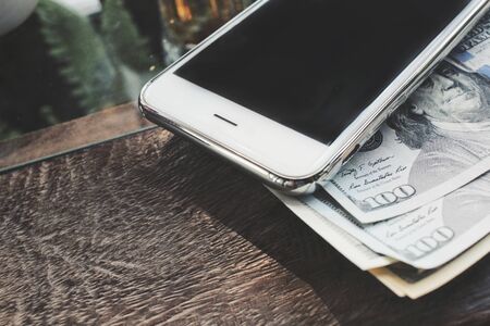 Dollar with smart phoneの写真素材