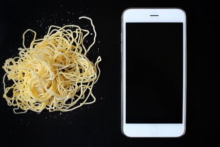 Egg noodles with smart phoneの写真素材