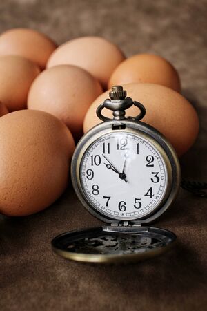 Eggs with vintage watch pocketの写真素材