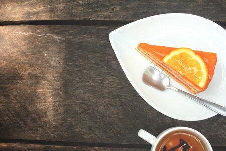 Orange cake with hot teaの写真素材
