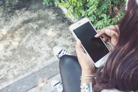 Woman using smart phoneの写真素材