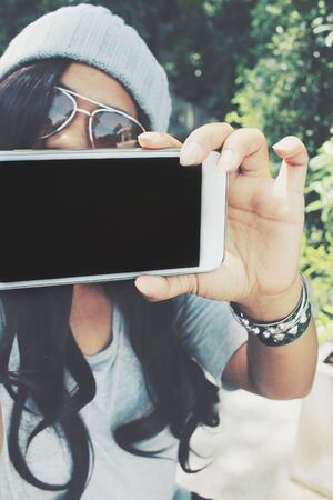 Woman taking a selfieの写真素材