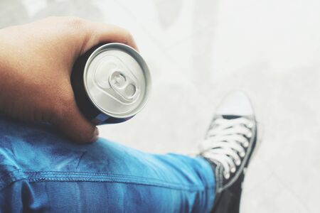Cola can on handの写真素材