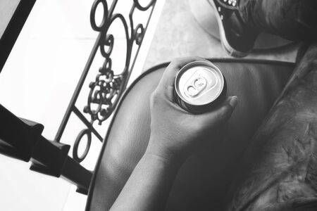 Cola can on handの写真素材
