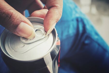 Cola can on handの写真素材
