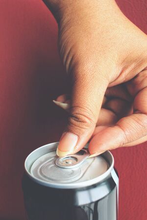 Cola can on handの写真素材