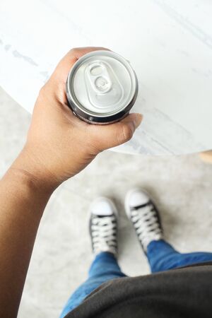 Cola can on handの写真素材