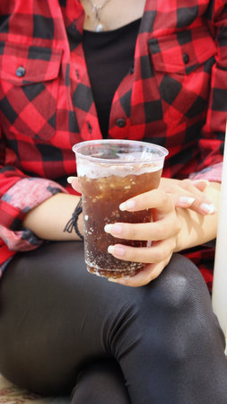 Woman drinking cola