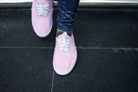 Legs of woman with sneakers