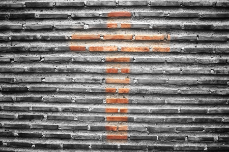 Cross on brick wall backgroundの写真素材