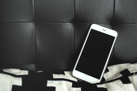 Smart phone on sofaの写真素材