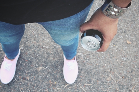 Cola can on handの写真素材