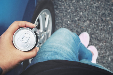 Cola can on hand