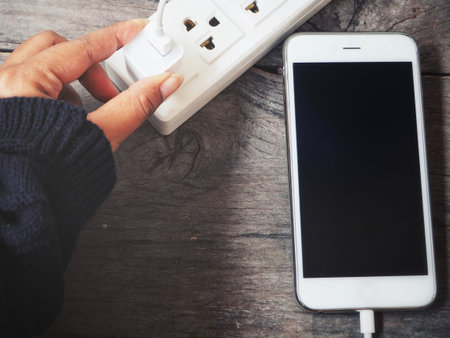 Smartphone charger with plug and socket